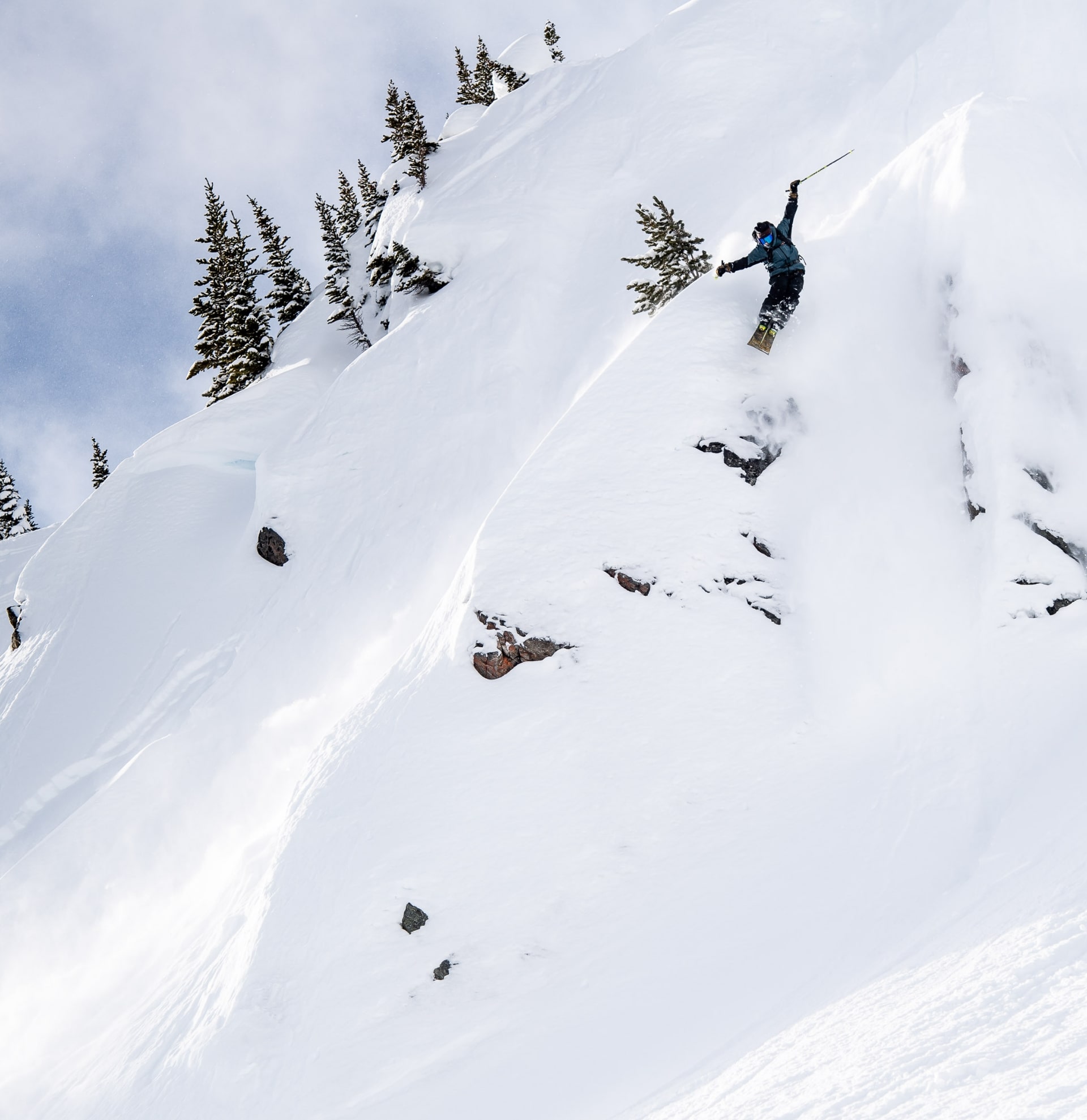 skier jumping in powder