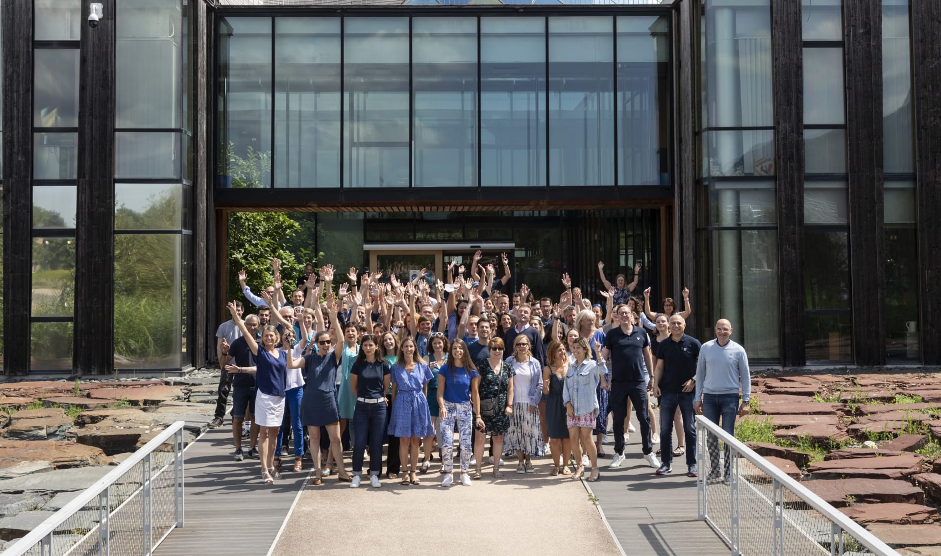 Photo of employees in front of the Rossignol Group head office